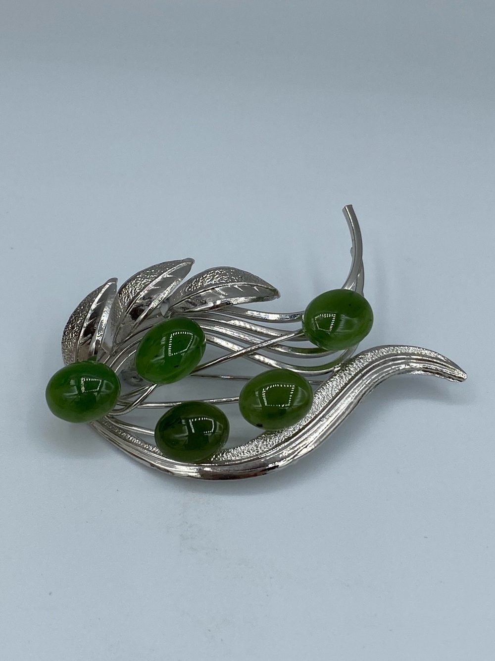 Silver-Tone Brooch with Glossy Green Cabochons